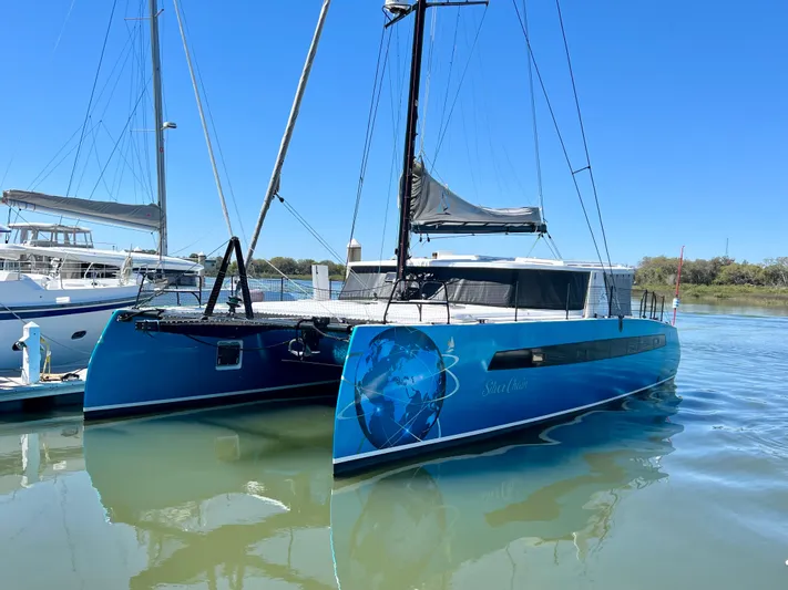 Silver Chain Yacht Photos Pics 2024 Balance 442 catamaran docked on calm water under clear blue sky.