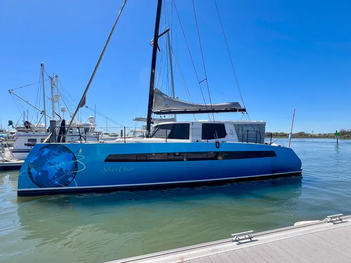 Silver Chain Yacht Photos Pics 2024 Balance 442 catamaran docked in a marina under clear blue skies.