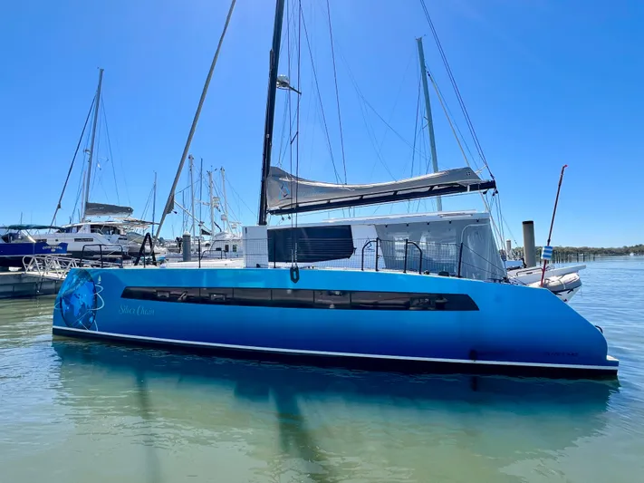 Silver Chain Yacht Photos Pics 2024 Balance 442 catamaran docked in marina, featuring sleek blue design and modern sails.