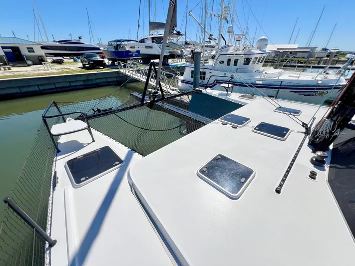 Silver Chain Yacht Photos Pics 2024 Balance 442 catamaran docked at marina with other boats in background.