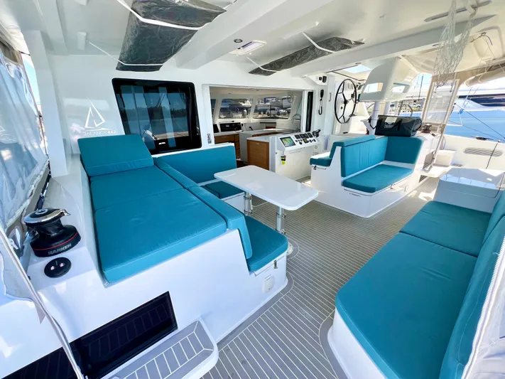 Silver Chain Yacht Photos Pics Luxurious 2024 Balance 442 yacht interior with teal seating and modern design.