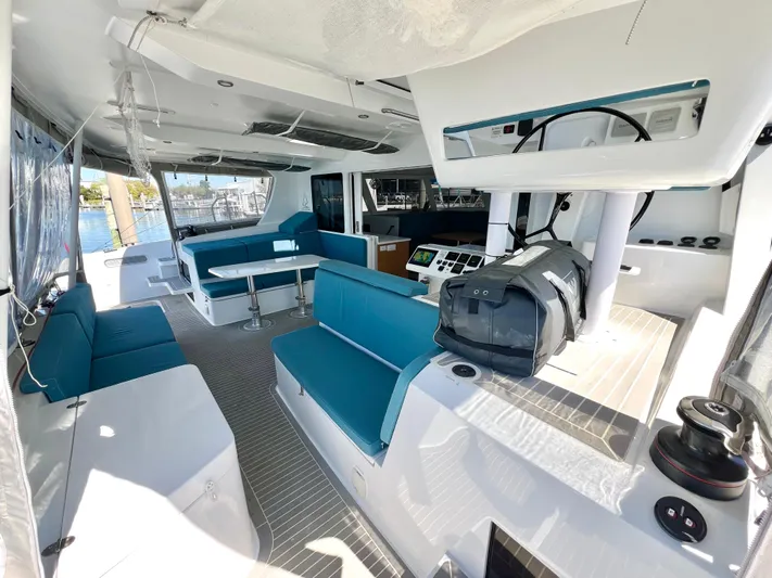 Silver Chain Yacht Photos Pics Luxurious interior of 2024 Balance 442 catamaran with modern seating and navigation equipment.