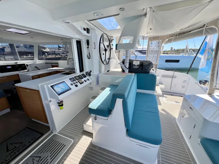 Silver Chain Yacht Photos Pics Modern 2024 Balance 442 yacht interior with blue seating and advanced navigation controls.