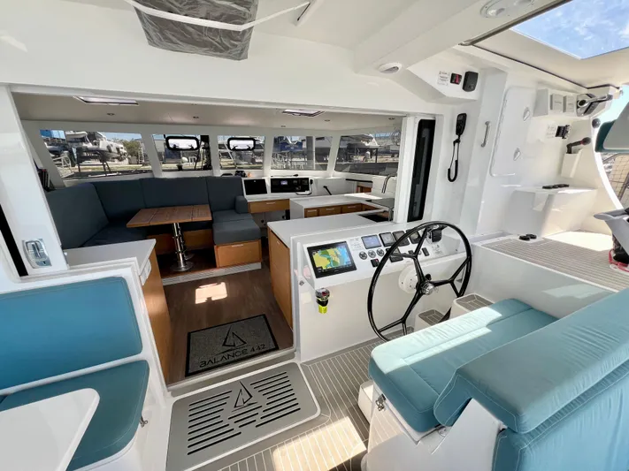 Silver Chain Yacht Photos Pics Modern interior of 2024 Balance 442 yacht with spacious seating and navigation area.