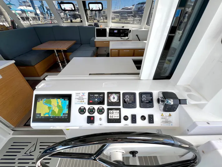 Silver Chain Yacht Photos Pics 2024 Balance 442 yacht interior with navigation controls and seating area.