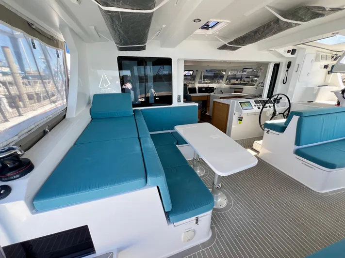 Silver Chain Yacht Photos Pics 2024 Balance 442 yacht interior with blue seating, modern helm, and spacious layout.