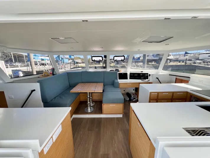 Silver Chain Yacht Photos Pics Luxurious interior of 2024 Balance 442 catamaran with modern seating and panoramic windows.
