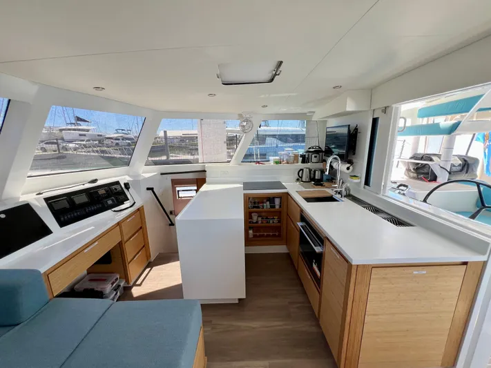Silver Chain Yacht Photos Pics Modern interior of 2024 Balance 442 yacht with sleek kitchen and panoramic windows.
