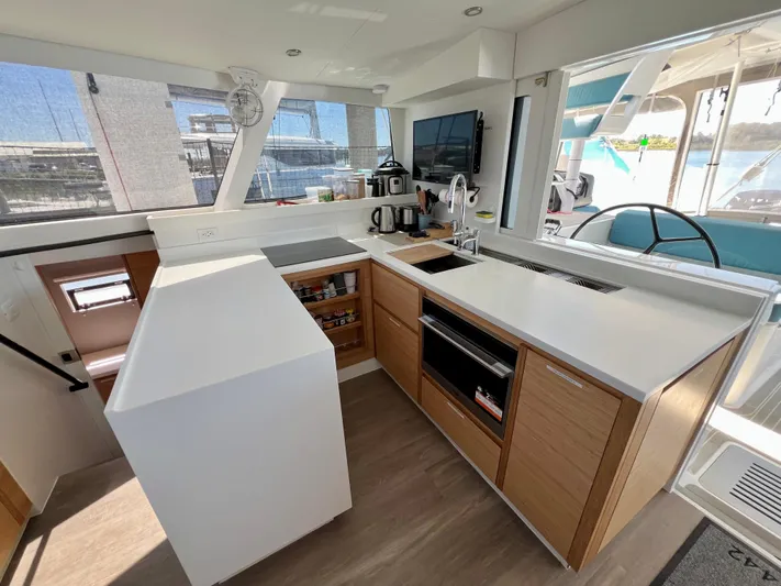 Silver Chain Yacht Photos Pics Modern kitchen interior on 2024 Balance 442 yacht, featuring sleek countertops and appliances.