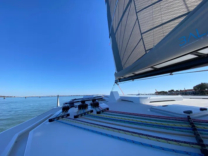 Silver Chain Yacht Photos Pics Sailing on a 2024 Balance 442 yacht with colorful ropes and clear blue skies.