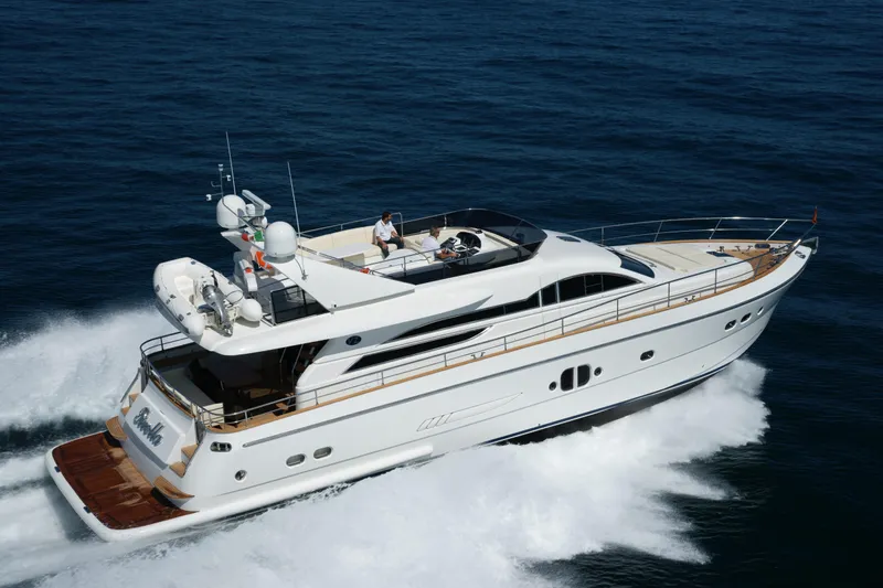  Yacht Photos Pics Luxurious 2009 VZ 68 yacht cruising on open sea, showcasing sleek design and elegance.