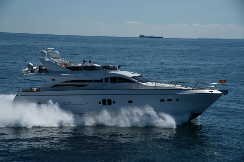  Yacht Photos Pics Luxurious 2009 VZ 68 yacht cruising swiftly on open sea.