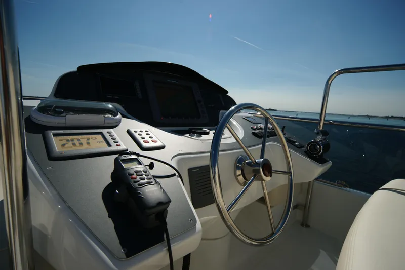 Yacht Photos Pics Steering console of 2009 VZ 68 boat with navigation equipment and ocean view.
