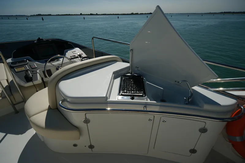  Yacht Photos Pics Luxury yacht VZ 68 (2009) with outdoor grill and seating area on deck.