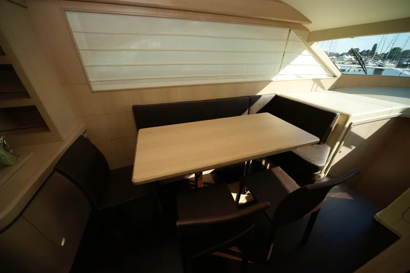  Yacht Photos Pics Luxurious interior of 2009 VZ 68 yacht with elegant dining area and window view.