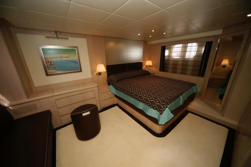  Yacht Photos Pics Luxurious bedroom interior in 2009 VZ 68 yacht with elegant decor and ambient lighting.