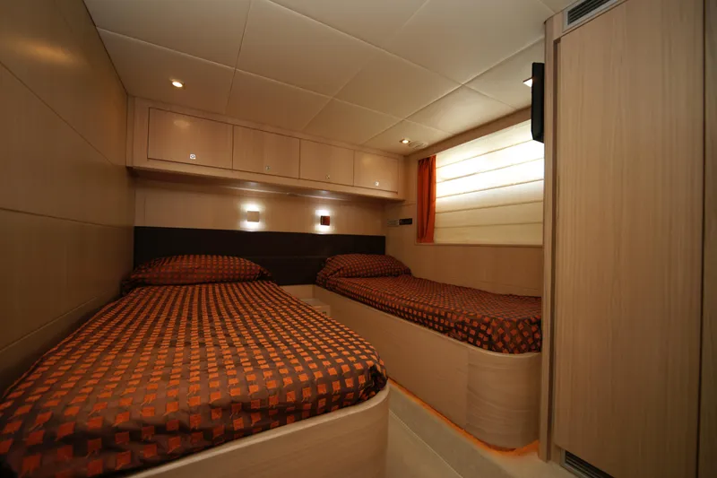  Yacht Photos Pics Twin cabin interior of 2009 VZ 68 yacht with modern wood finish.