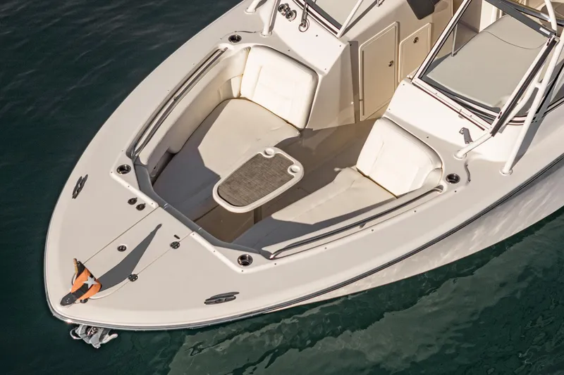  Yacht Photos Pics 2018 Grady-White Freedom 307 boat, spacious deck, sleek design, on calm water.