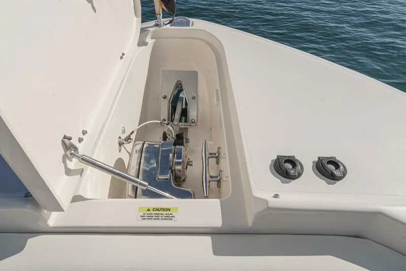  Yacht Photos Pics 2018 Grady-White Freedom 307 boat anchor compartment with open hatch, showing winch and fittings.