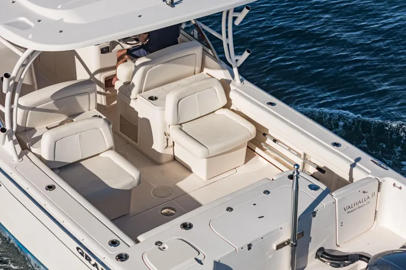  Yacht Photos Pics 2018 Grady-White Freedom 307 boat interior with seating, on the water.
