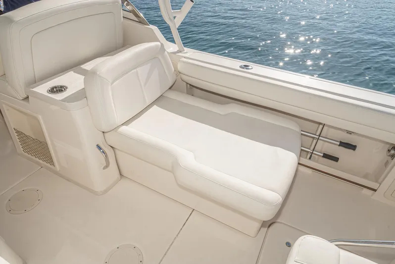  Yacht Photos Pics 2018 Grady-White Freedom 307 boat interior with white cushioned seating.