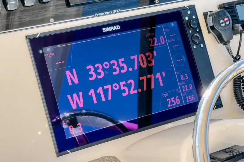  Yacht Photos Pics Simrad GPS display on 2018 Grady-White Freedom 307 boat showing coordinates and navigation data.