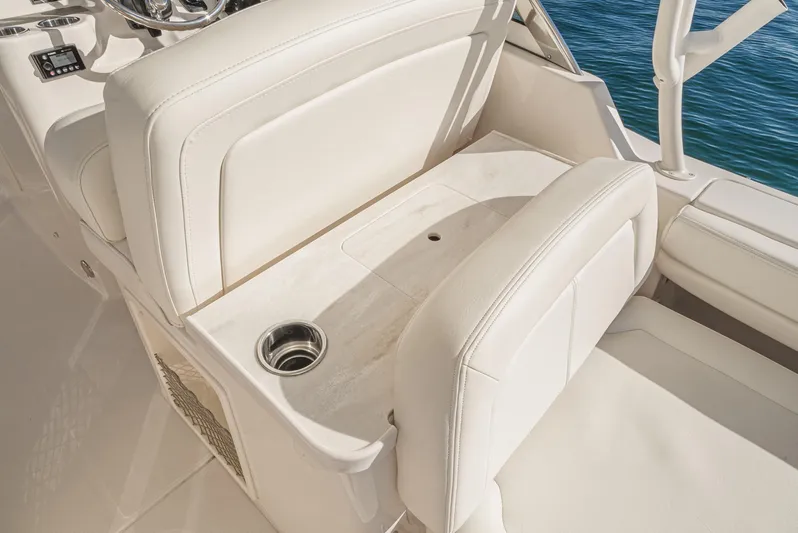  Yacht Photos Pics 2018 Grady-White Freedom 307 boat interior with white seating and cup holder.