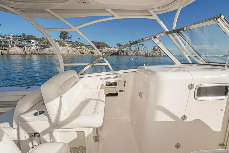  Yacht Photos Pics 2018 Grady-White Freedom 307 boat interior with coastal view, featuring comfortable seating and sleek design.