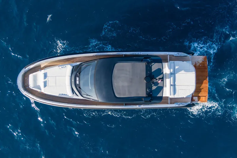 Ciao L Yacht Photos Pics Aerial view of 2022 SACS Rebel 55 yacht cruising on blue ocean waters.