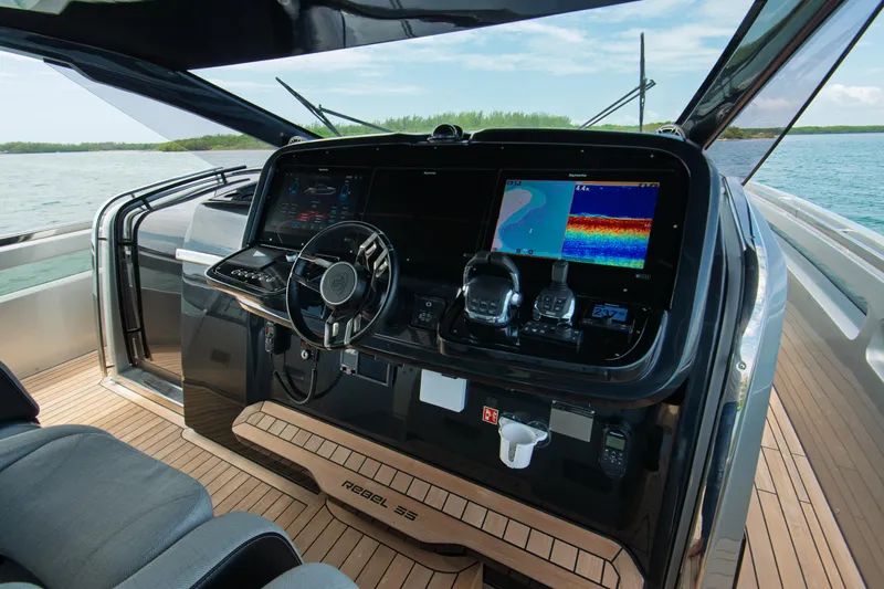 Ciao L Yacht Photos Pics Helm of 2022 SACS Rebel 55 yacht with advanced navigation systems.