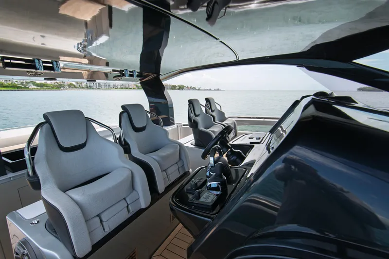 Ciao L Yacht Photos Pics Luxury interior of 2022 SACS Rebel 55 yacht with modern seating and controls.