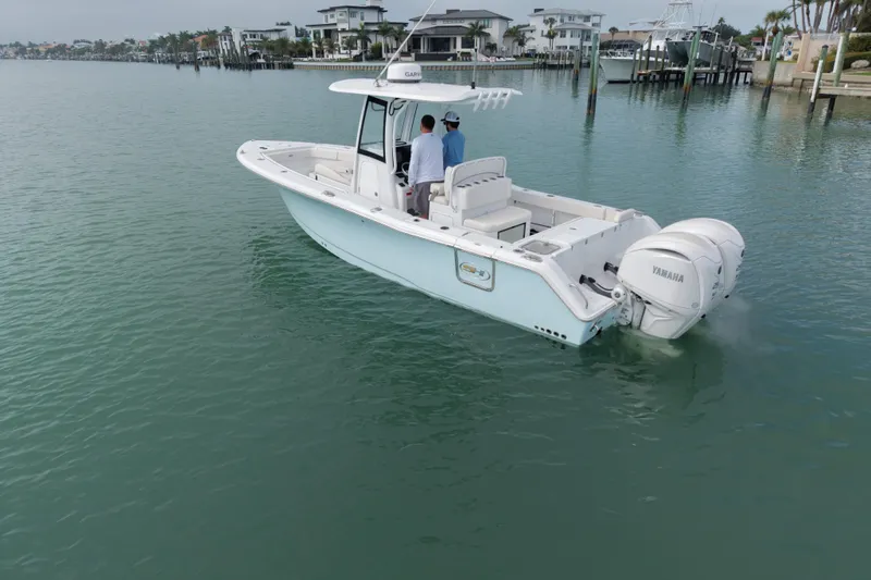  Yacht Photos Pics 2024 Sea Hunt Gamefish 27 Coffin Box boat on calm water, featuring dual Yamaha engines.