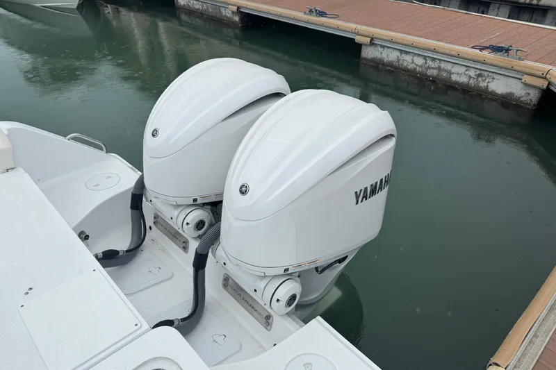  Yacht Photos Pics 2024 Sea Hunt Gamefish 27 Coffin Box with twin Yamaha outboard engines at dock.