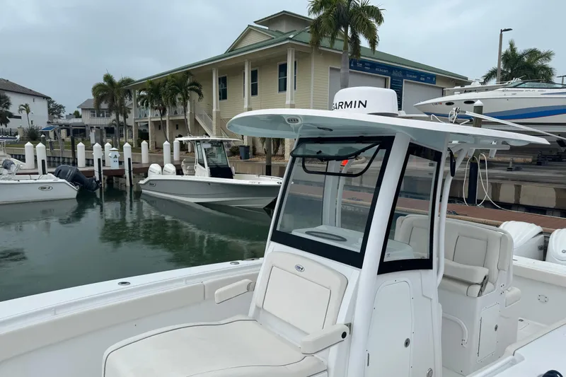  Yacht Photos Pics 2024 Sea Hunt Gamefish 27 Coffin Box boat docked at marina with palm trees.