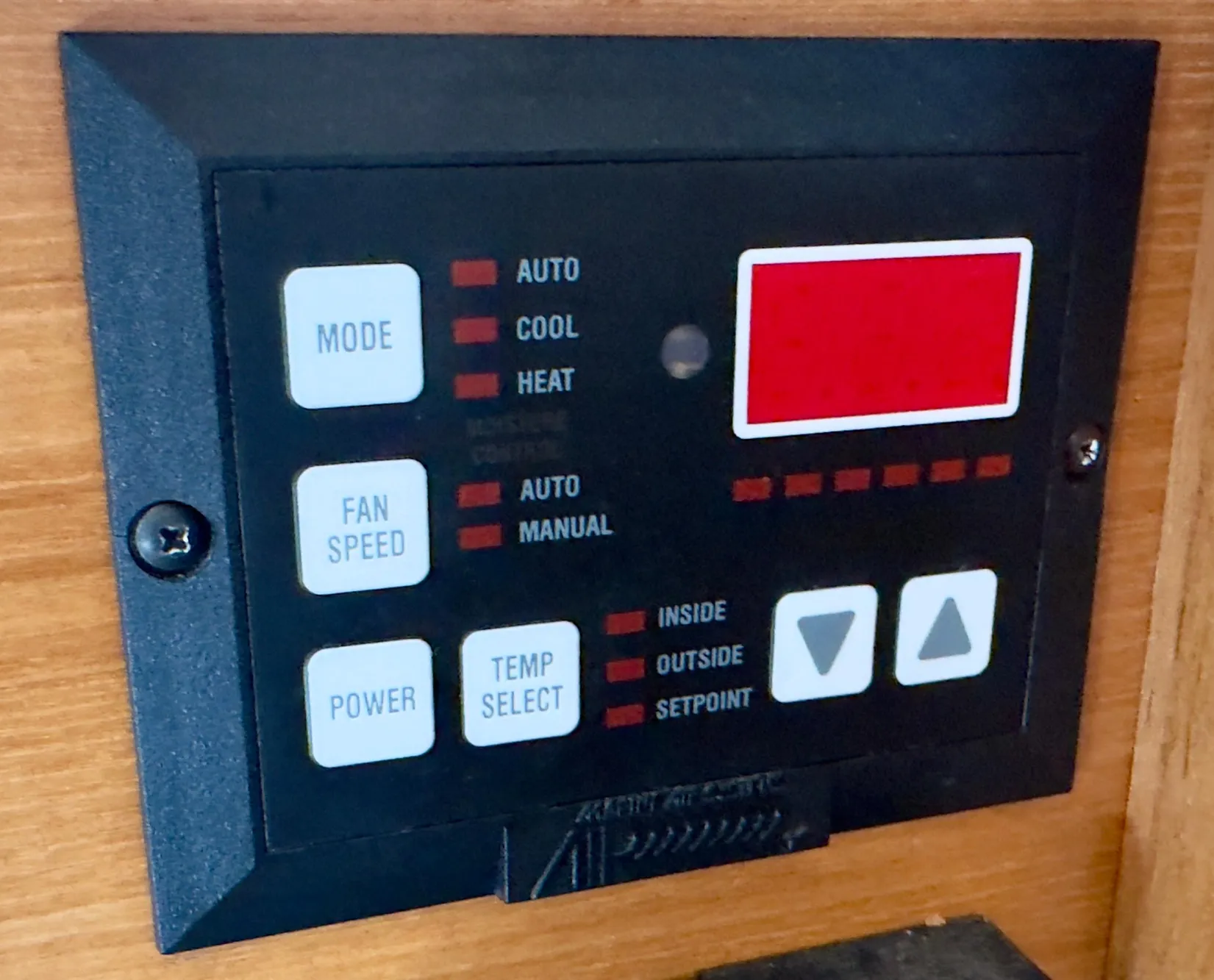 Control panel of a 1998 Bayliner 3388 Command Bridge Motoryacht, featuring mode and temperature settings.