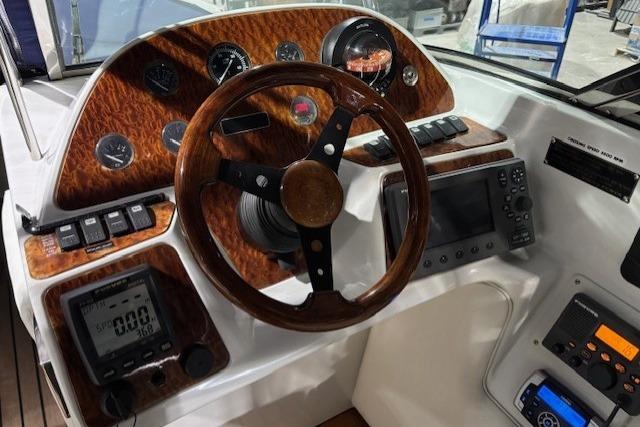 1998 Craig Craft Launch dashboard with wood accents, steering wheel, and navigation instruments.