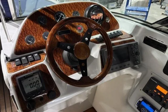 1998 Craig Craft Launch dashboard with wood accents, steering wheel, and navigation instruments.