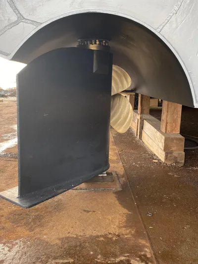 T1 Yacht Photos Pics Propeller and rudder of 2009 Custom Aluminum Landing Craft on dry dock.