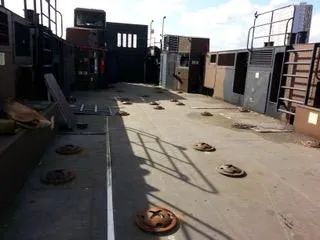 T1 Yacht Photos Pics 2009 Custom Aluminum Landing Craft with open deck and metal fixtures under clear sky.