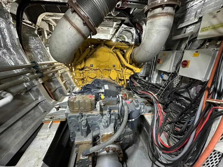 T1 Yacht Photos Pics Engine room of a 2009 Custom Aluminum Landing Craft with visible machinery and wiring.