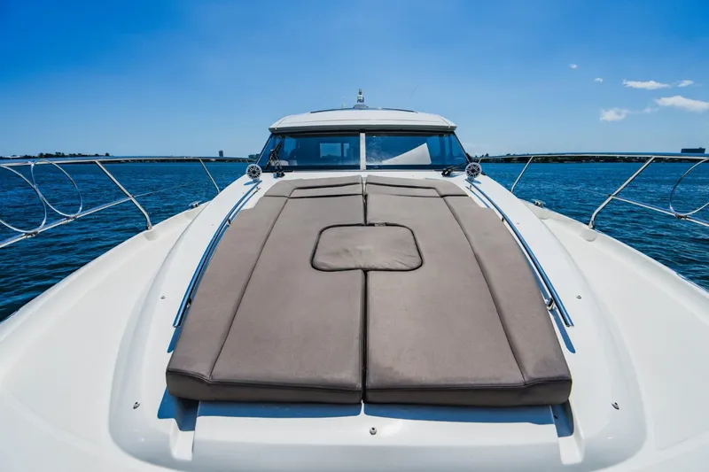 Invictus Yacht Photos Pics Prestige 500 S 2018 yacht with sunbathing area on deck, cruising on a sunny day.