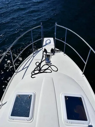 Denial Yacht Photos Pics 2012 Cutwater C-28 boat deck with railings and hatches on open water.