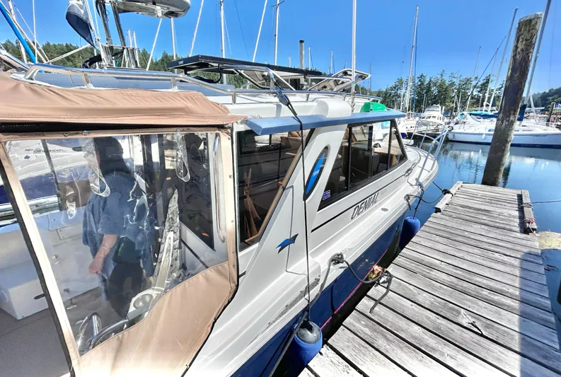 Denial Yacht Photos Pics 2012 Cutwater C-28 boat docked at a marina with clear blue skies.
