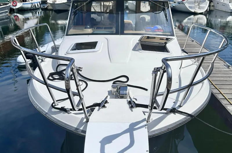 Denial Yacht Photos Pics 2012 Cutwater C-28 boat docked at marina, front view with railings and deck.