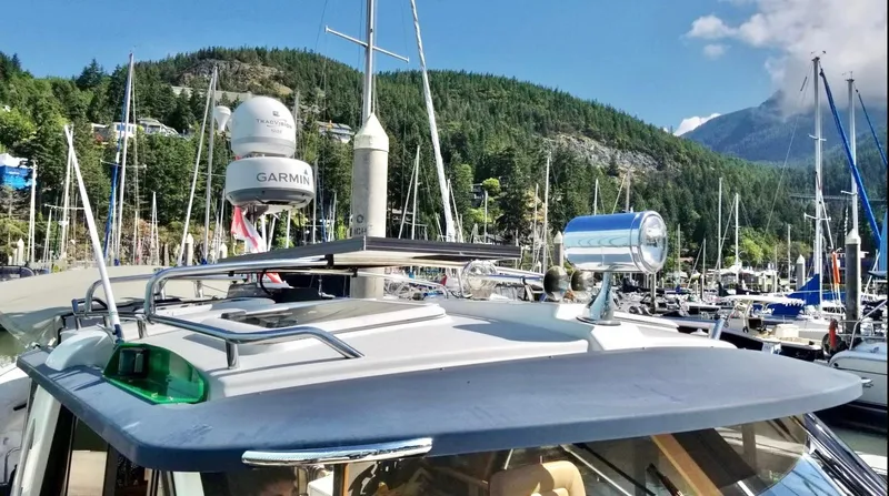 Denial Yacht Photos Pics 2012 Cutwater C-28 boat docked in a marina with lush green hills in the background.