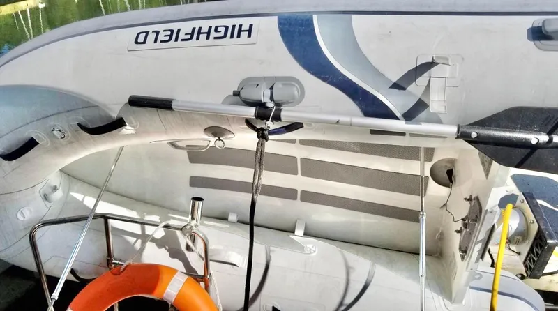 Denial Yacht Photos Pics Inflatable boat on Cutwater C-28, 2012 model, with life preserver and oar.