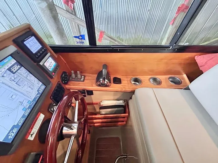 Denial Yacht Photos Pics Interior of 2012 Cutwater C-28 boat cockpit with navigation controls and steering wheel.