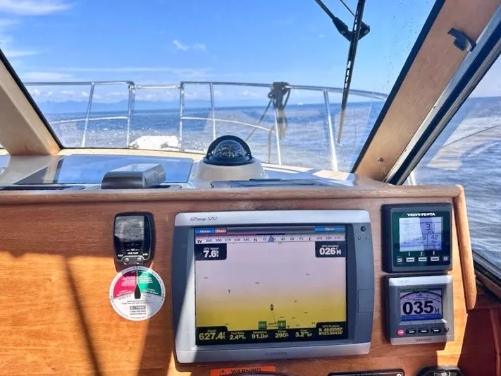 Denial Yacht Photos Pics Cutwater C-28 boat dashboard with navigation instruments, 2012 model, ocean view in background.
