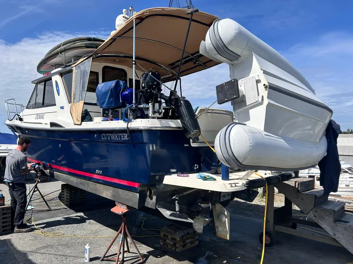 Denial Yacht Photos Pics 2012 Cutwater C-28 boat on dry dock with inflatable dinghy attached.