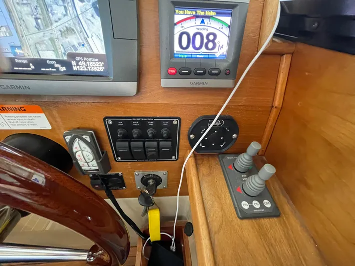 Denial Yacht Photos Pics Control panel of a 2012 Cutwater C-28 boat with navigation and throttle controls.